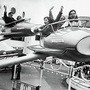 The Spanish City amusement park in Whitley Bay - youngsters flying high on one of