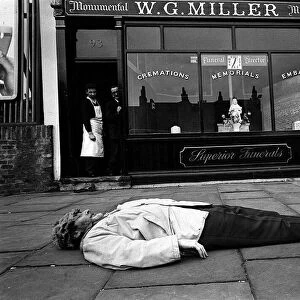 Spike Milligan comedian and author March 1963 prostrate on the pavement in front