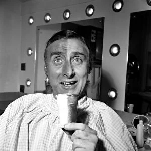 Spike Milligan making up for his part in his new TV series as a Pakistani