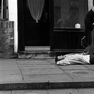Spike Milligan March 1963 comedian prostrate outside an Islington undertakers
