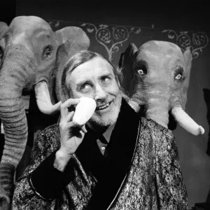 Print of Spike Milligan in BBC Jackanory studio with plastic elephants