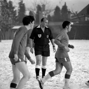 Sport Amateur football youth game in action in the snow near Maidshow between two local Sport Amateur football youth game in action in the snow near Maidshow between two local