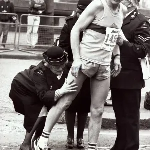 Sport - London Marathon An athlete recieves attention from medics after receiving Sport - London Marathon An athlete recieves attention from medics after receiving