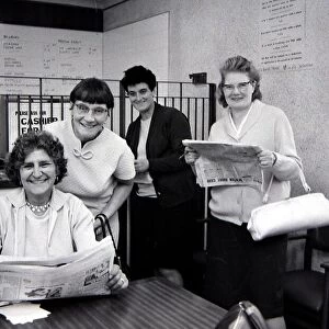 Four sporting ladies smiling after placing winning bets at a Ladies only betting shop in