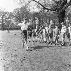 Sports mistress, Miss Reid, teaches football to the boys of Park Hill School, Kingston Sports mistress, Miss Reid, teaches football to the boys of Park Hill School, Kingston