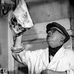 St Johns Old Market, Liverpool, 26th September 1958. Market veteran reaching up for a St Johns Old Market, Liverpool, 26th September 1958. Market veteran reaching up for a