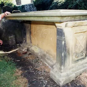 St Nicholas church tomb, church warden Ken Brookfield examines a tombstone in St Nicholas church tomb, church warden Ken Brookfield examines a tombstone in