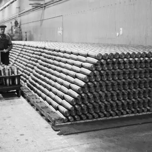 Stacking shells for anti-aircraft guns in a midland shell factory. 4th October 1939