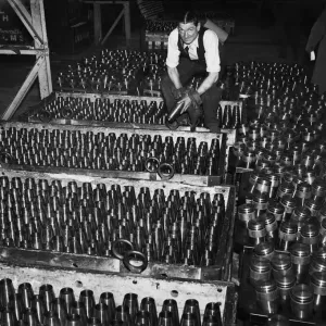 Stacking shells for anti-aircraft guns in a midland shell factory. 4th October 1939