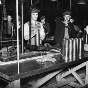 Stacking shells for anti-aircraft guns in a midland shell factory. 4th October 1939