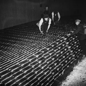 Stacking shells for anti-aircraft guns in a midland shell factory. 4th October 1939