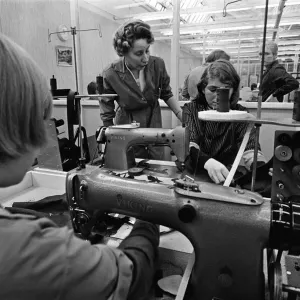 Staff at work at Burton the Tailors, Leeds. Mrs Mary Kirby teaches Sylvia James, 15 Staff at work at Burton the Tailors, Leeds. Mrs Mary Kirby teaches Sylvia James, 15