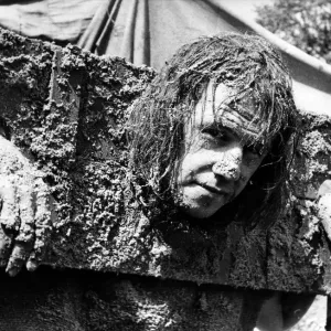 Standing in the stocks and getting facefuls of sand pies is Brian Lowes of Sedgefield