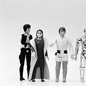 Star Wars toys. Figures from left to right, Han Solo, Leia Organa, Luke Skywalker, C-3PO