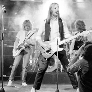 Status Quo performing on stage on BBC TV Programme "Top of the Pops"March 1982