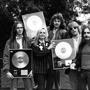 Status Quo, are presented with more Gold and Platinum Discs at The Eurocrest Hotel