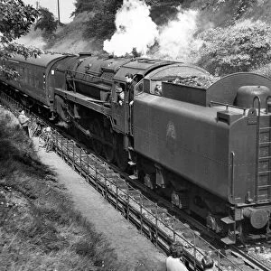 Steam locomotive 92079 blasts up from Bromsgrove bank on the tail of a heavy Bristol to