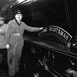 Steam train Flying Scotsman with owner Alan Pegler seen here standing beside the name