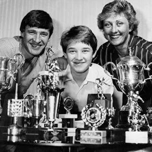 Stephen Hendry and his proud parents pose with just some of his glittering collection of