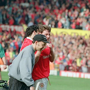 Steve Bruce, congratulated by Ryan Giggs (number 11) pictured at the end of the match