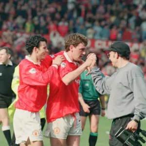 Steve Bruce, congratulated by Ryan Giggs (number 11) pictured at the end of the match Steve Bruce, congratulated by Ryan Giggs (number 11) pictured at the end of the match