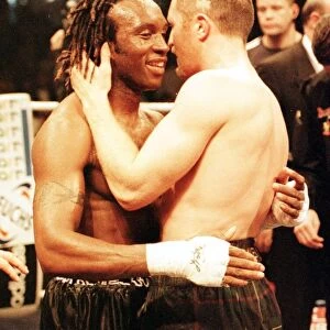 Steve Collins celebrates after beating Nigel Benn (L) in the WBO middleweight fight in