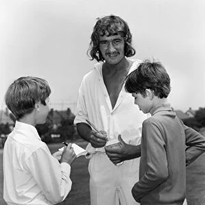 Steve Kember of Crystal Palace signs autographs before taking part in cricket match