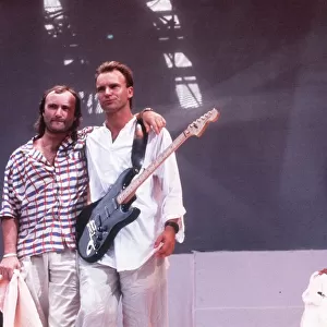 Sting singer and Phil Collins at a live aid concert at Wembley