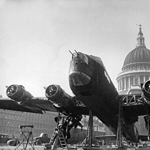 A Stirling bomber in front of St Pauls Cathedral in the City of London