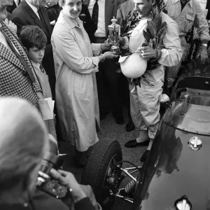 Stirling Moss, driving a Lotus-Climax, wins the Gold Cup race at Oulton Park, Cheshire