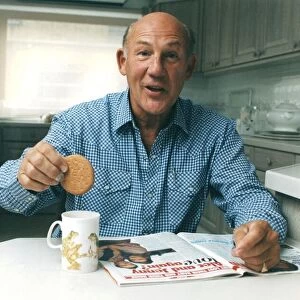 Stirling Moss dunkning biscuit in cup of tea reading magazine - June 1993