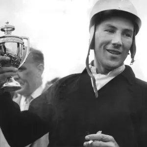 Stirling Moss holding trophy celebrating motor racing victory - September 1959 Stirling Moss holding trophy celebrating motor racing victory - September 1959