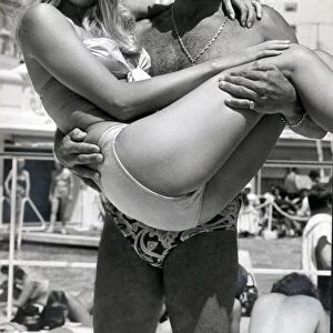 Stirling Moss and model Liz Hooley in Monte Carlo - June 1973