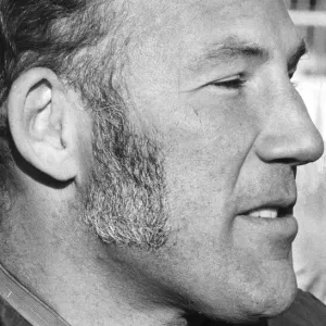 Stirling Moss in profile serious during interview at track - December 1971 Stirling Moss in profile serious during interview at track - December 1971