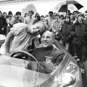 Stirling Moss sitting in Ferrari racing car with wife Suzy standing beside hie at Oulton Stirling Moss sitting in Ferrari racing car with wife Suzy standing beside hie at Oulton