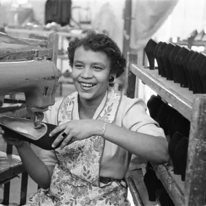 Stitching a upper of a shoe at the H Solomons shoe factory in Tottenham. 30th July 1956 Stitching a upper of a shoe at the H Solomons shoe factory in Tottenham. 30th July 1956