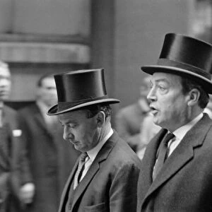 Two stockbrokers seen here walking through the City of London in their silk hats