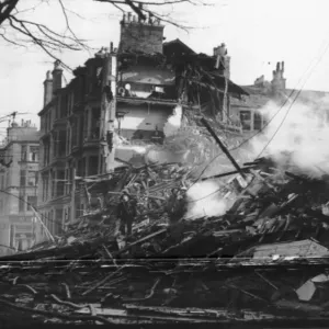 A four story house, now a wreck after it was hit in a German Air raid A four story house, now a wreck after it was hit in a German Air raid