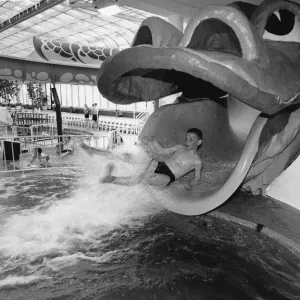 Straight from the Dragons mouth. A young visitor enjoys the Giant Dragon water chute Straight from the Dragons mouth. A young visitor enjoys the Giant Dragon water chute