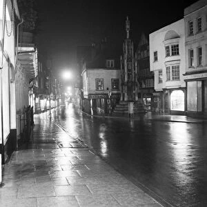 Street and general scenes at night in the city of Winchester, Hampshire. 1953