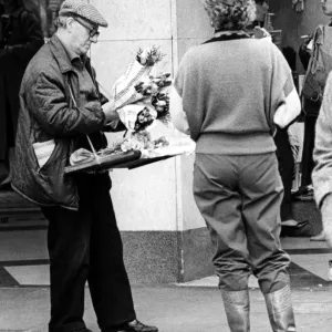 A street trader selling flowers on Northumberland Street, Newcastle on 19th October 1984