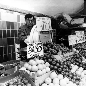 A street trader on the streets of Newcastle selling fruit