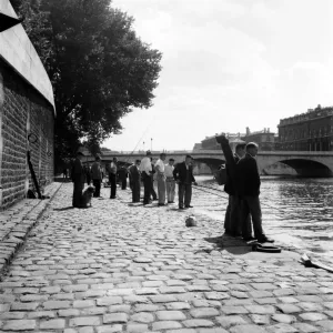 Strike: Frenchmen fishing in the River Seine, Paris during the general strike Strike: Frenchmen fishing in the River Seine, Paris during the general strike