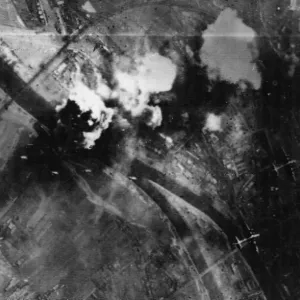 Strings of bombs head for the already burning target at Regensburg
