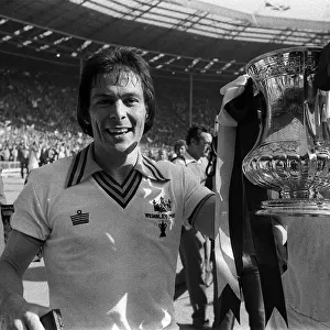 Stuart Pearson of West Ham holds the FA Cup after West Ham had beaten Arsenal in