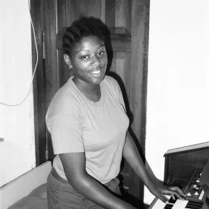 Student teacher plays the piano in Kingston, Jamaica, January 1984 Student teacher plays the piano in Kingston, Jamaica, January 1984