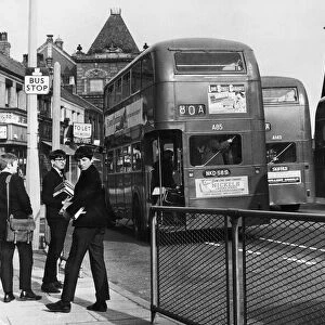 Students of Liverpool University waiting at the bus stop on the Smithdown Road