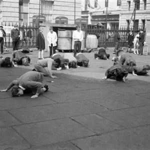 Students and young people taking part in a pea pushing contest for the charity Students and young people taking part in a pea pushing contest for the charity