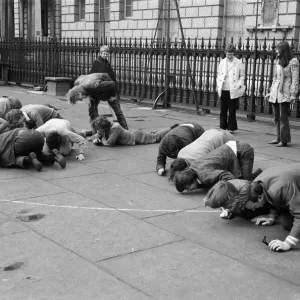 Students and young people taking part in a pea pushing contest for the charity Students and young people taking part in a pea pushing contest for the charity