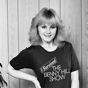 Sue Upton, model and actress, December 1978. Studio pix wearing tshirt "